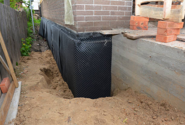 SJ Waterproofing Pros technician performing targeted Waterproofing assessment in King George, VA
